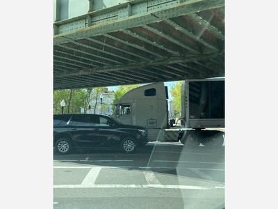 Truck stuck under bridge/train at Morris Ave & Elm St